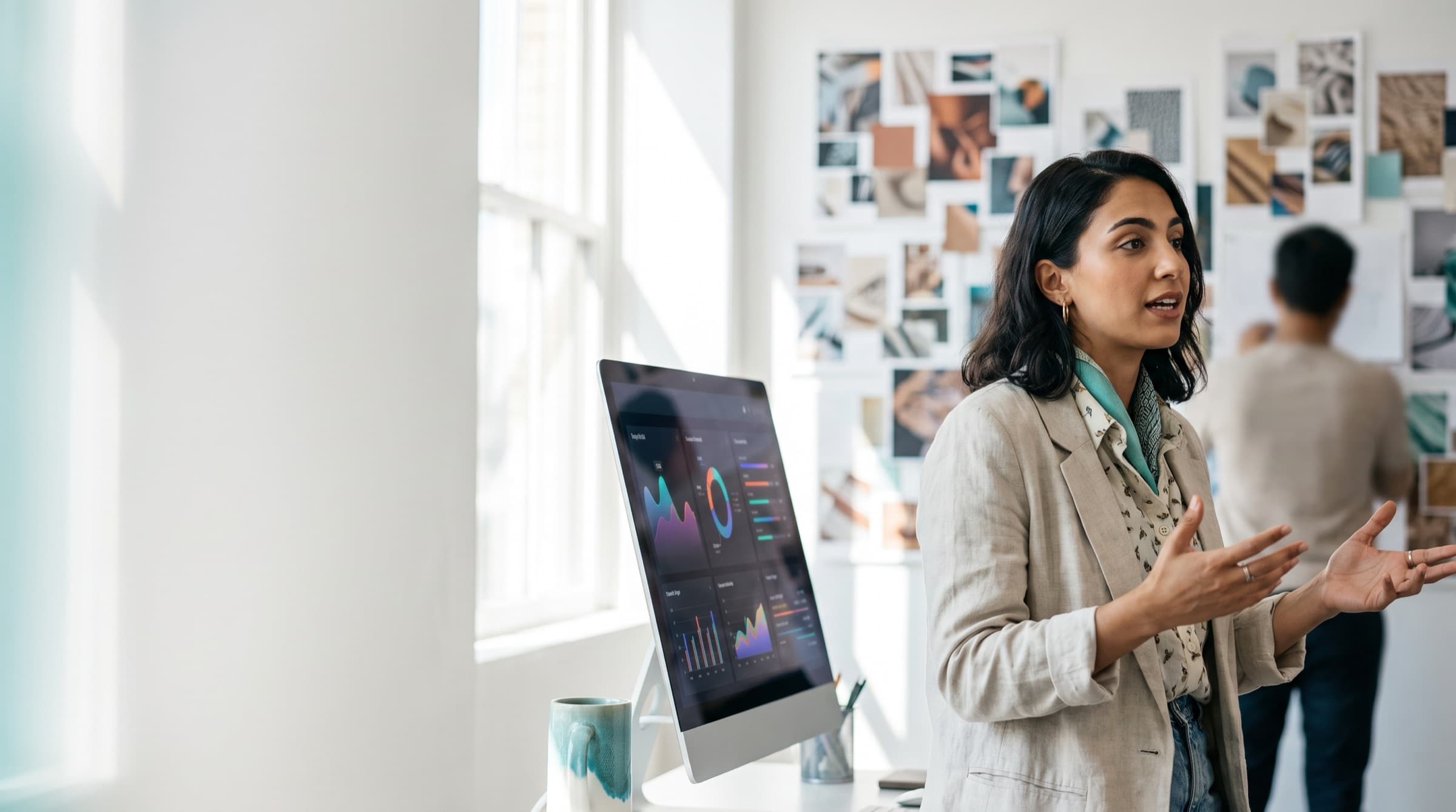 An agency founder talks through a project in a bright creative studio